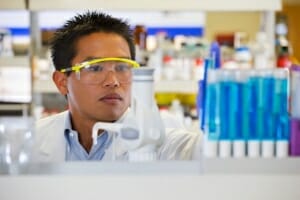 Pacific Islander scientist working in lab